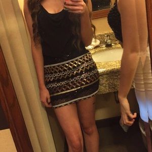 Mini black dress with gold sequin skirt